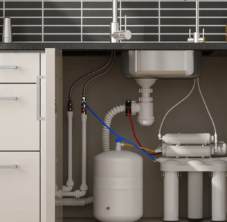 a kitchen sink with a water tank and a hose