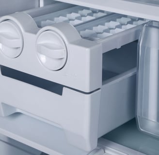 a refrigerator with a refrigerator door open and a drawer with a drawer with a drawer