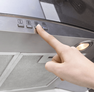 a person pointing at a stove top oven