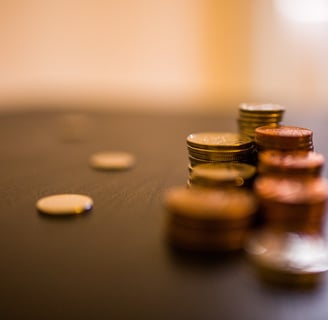 a stack of coins and coins sitting on a table