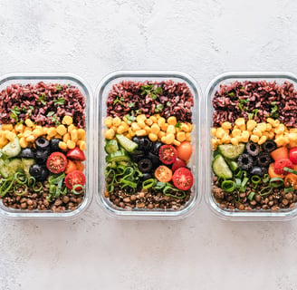 Three containers of food that include rice, beans, and veggies made after learning how to meal prep