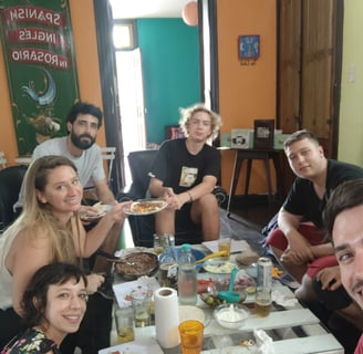 A group of people enjoying a meal together at a dining table