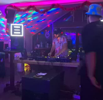 a man becing the DJ pult, mixing music