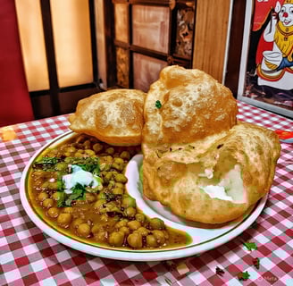 Chole bhature recipe, a plate of food with breaded bread and a bowl of soup