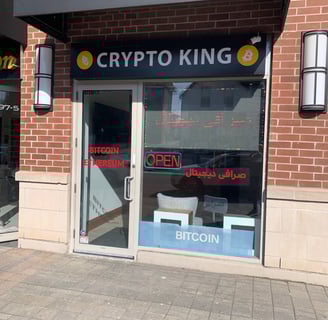 a crypt king storefront door with crypt currency