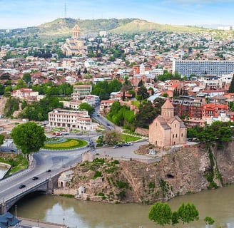 Panoramic view of Tbilisi from Narikala Fortress at sunset, Traditional sulfur baths in the Abanotub