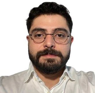 a man with a beard and glasses on his head