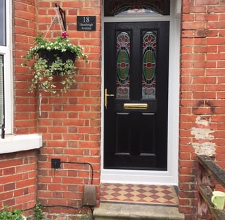 new black front door with bespoke glass which was fitted in Woolston, Southampton by Buildmydoor