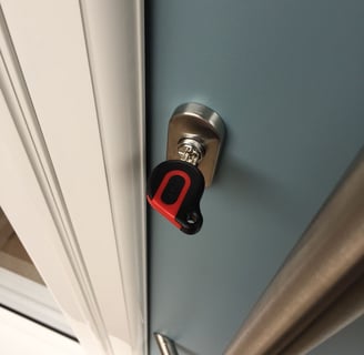 an ultion key on a new duck egg blue composite door