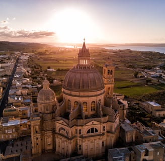 Sunrise over St. John Baptist Church. Gozo, Malta.