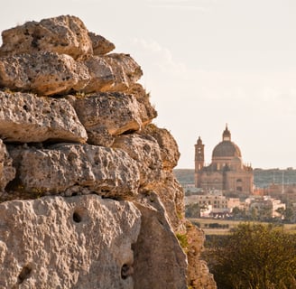 Punic wall in the foreground, St John's church in the distance. 