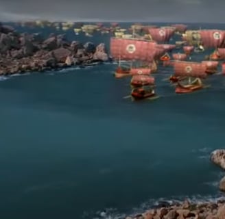 A group of Spartan ships sailing on a large body of water.