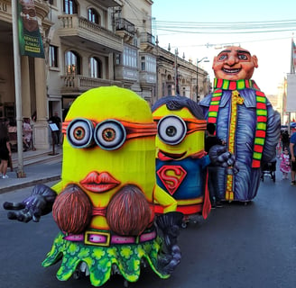 Carnival floats in Victoria, Gozo. Two minions followed by Gru.