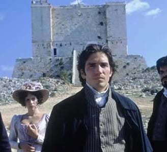 Agroup of people standing in front of a tower.