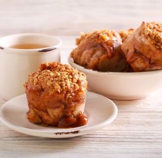 Caramel Apple Muffins on a table with coffee