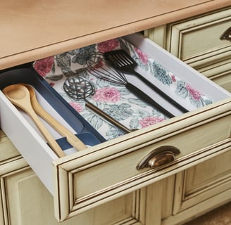 a drawer with utensils in it