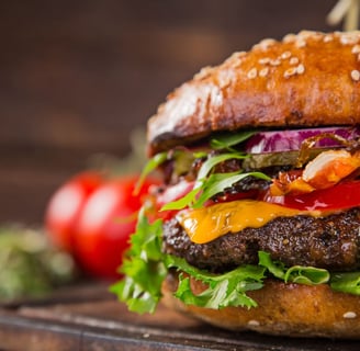 a hamburger with all of the trimmings