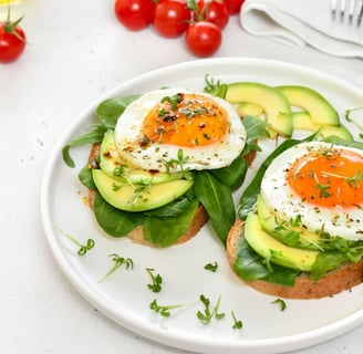 Avocado toast with egg on top sprinkled with parsley