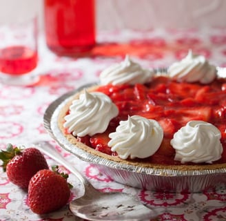 a pie with whipped cream and whipped cream