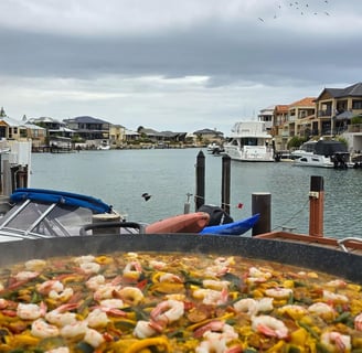 Serving Kamal's legendary Paella on the Mandurah estuary 