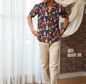 a man in a colorful shirt and tan pants