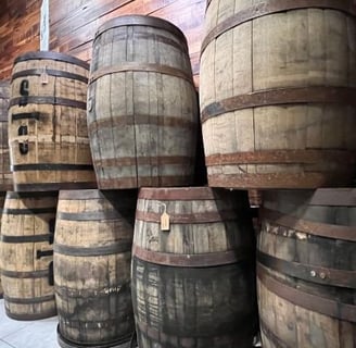 a bunch of barrels of wine barrels stacked on top of each other