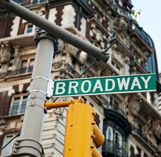 a street sign that says broadway broadway