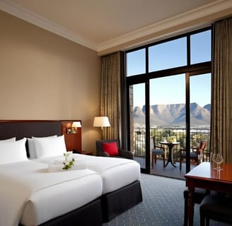 a hotel room with a view of a mountain