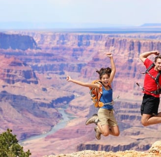 a couple of people jumping in the air