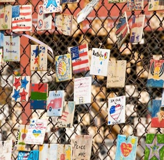 a fenced in area with many cards and pictures