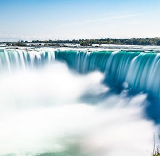 a waterfall in the middle of a large waterfall