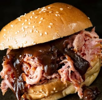 a sandwich sandwich with meat and cheese on a bunt