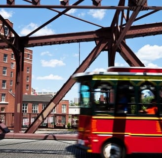 a bus driving over a bridge over a bridge