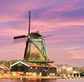 a windmill windmill in the middle of a river