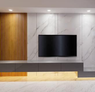 a tv screen mounted on a wall in a living room