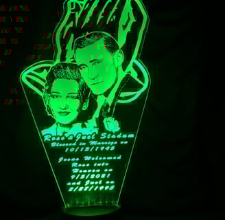 a green lighted up sign with a picture of a man and woman