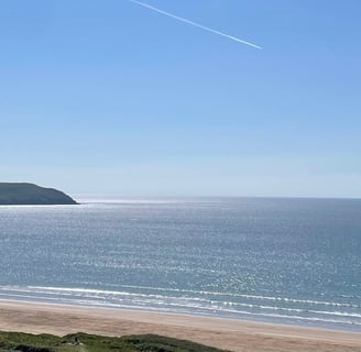 Woolacombe Beach, the sun sparkling on the sea