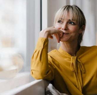 a woman sitting on a couch in a living room