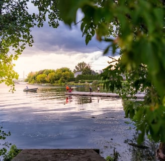 a person in a canoe on a lake Brossard