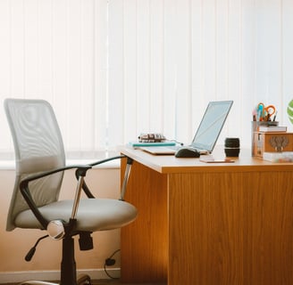 office desk with chair and laptop