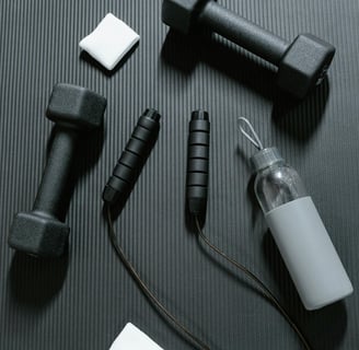 gym eqyipment dumbells and bottle