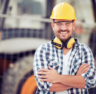 a man in a yellow helmet and a yellow helmet; buildwithampro.com