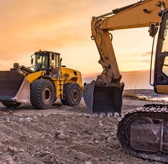 a tractor with a bulldozer and a bulldozer; BUILDWITHAMPRO.COM
