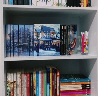 a bookshelf with books and decorations