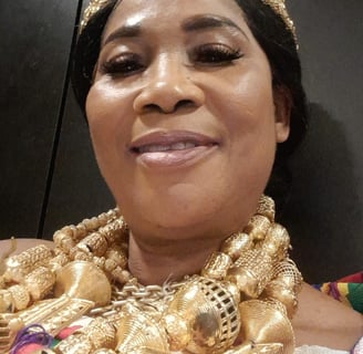 a woman in a gold necklace and a gold necklace