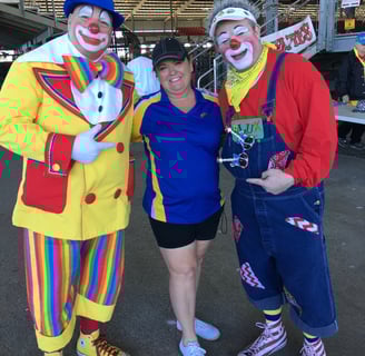 Deanna the Inspector standing next to 2 clowns