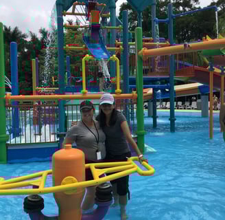 2 women inspectors in a kids splash pool
