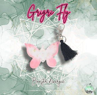 Porte clé en forme de papillon rose avec ponpon noir