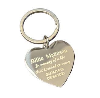 a heart shaped keychain with memorial
