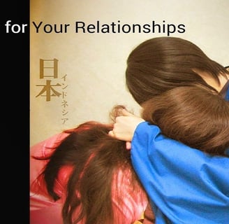 a woman and a man are hugging in front of a wall